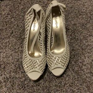 Bebe white woven high heels.